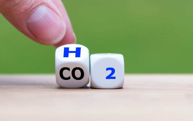 Change to fuel cell vehicles. Hand flips a dice and changes the expression CO2 to H2.